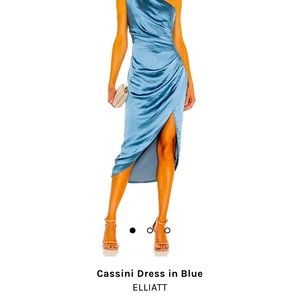 One shoulder cocktail dress. Has a slight slit in the front. Never worn